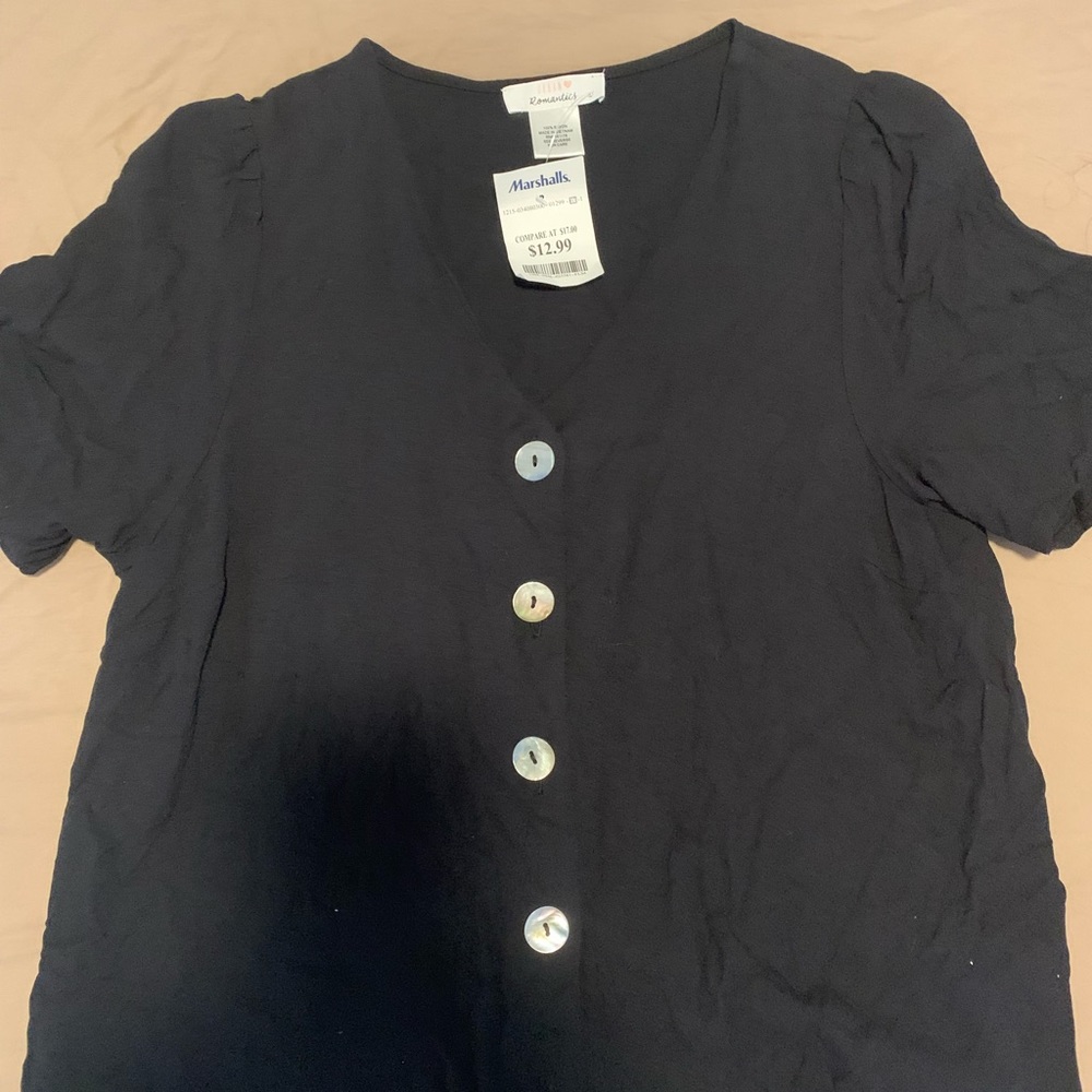 Black top. NEW front buttons. Short sleeves